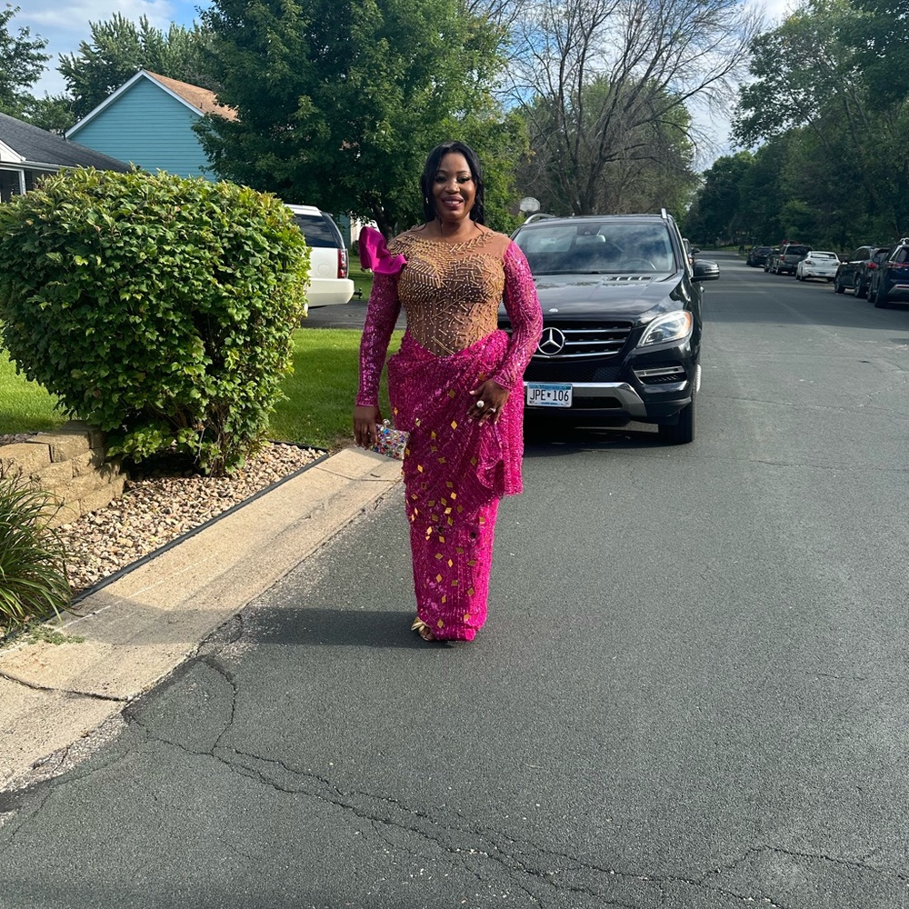 Beautiful lace African dress. Wore once to a wedding. Had a lot of compliments
